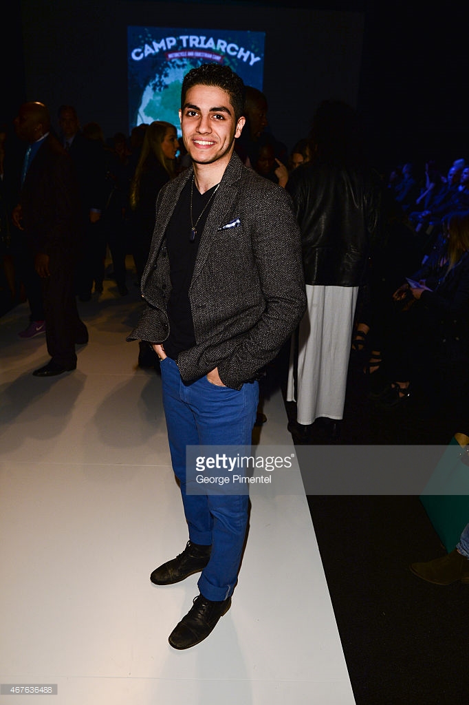 Mena Massoud attends World MasterCard Fashion Week Fall 2015 Collections Day 3 at David Pecaut Square.