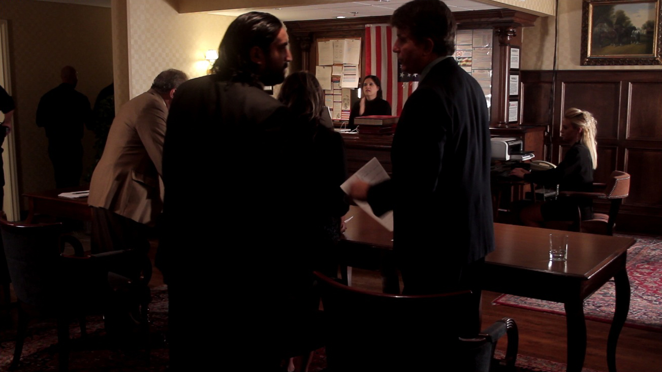 Still of Nick Baldasare (Brubaker) and Ronnie Banerjee in DSK Unauthorized