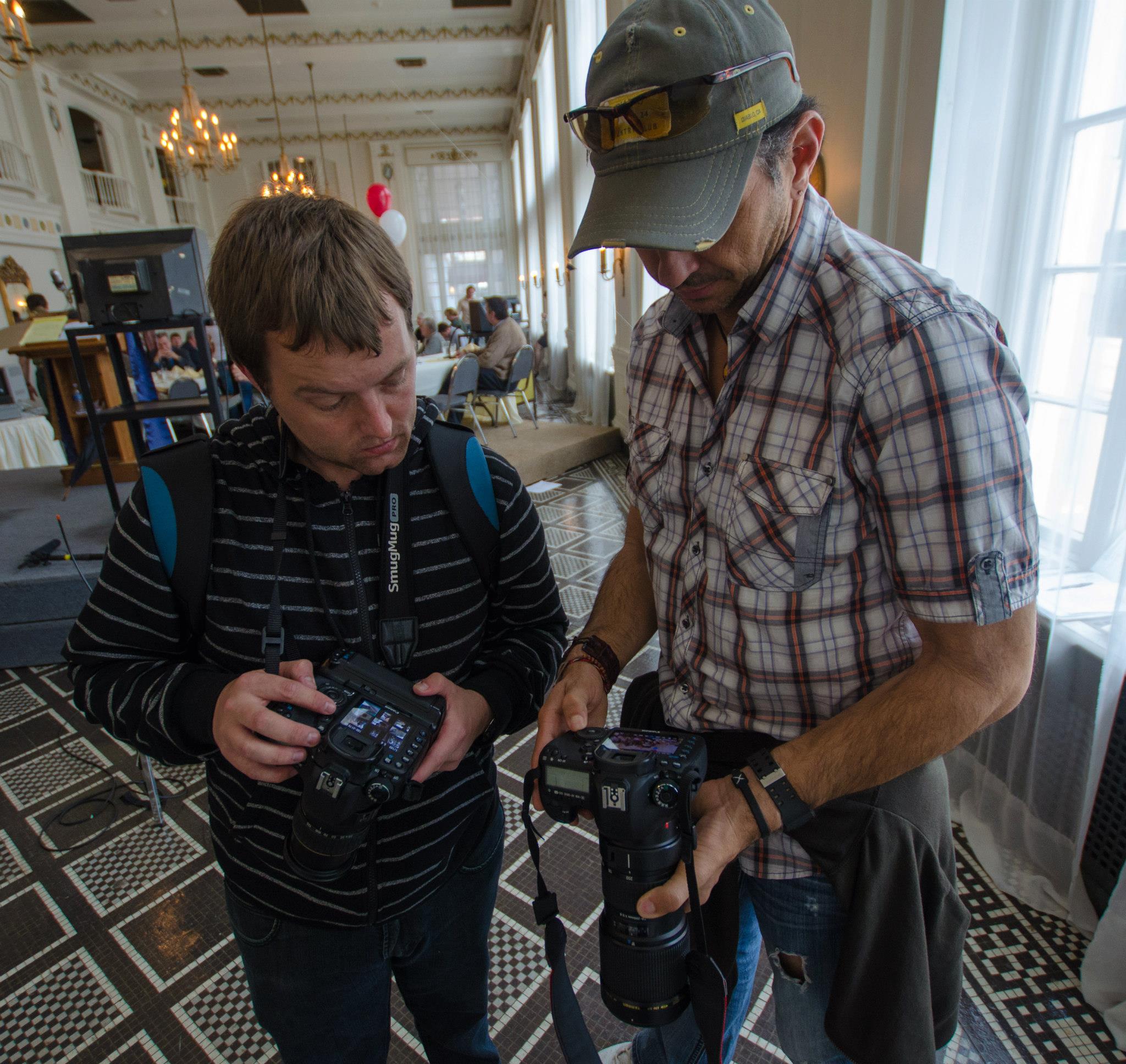 Travis Fox and Jamie Knapp checking camera settings for behind the scenes team on set of The Umbrella Man