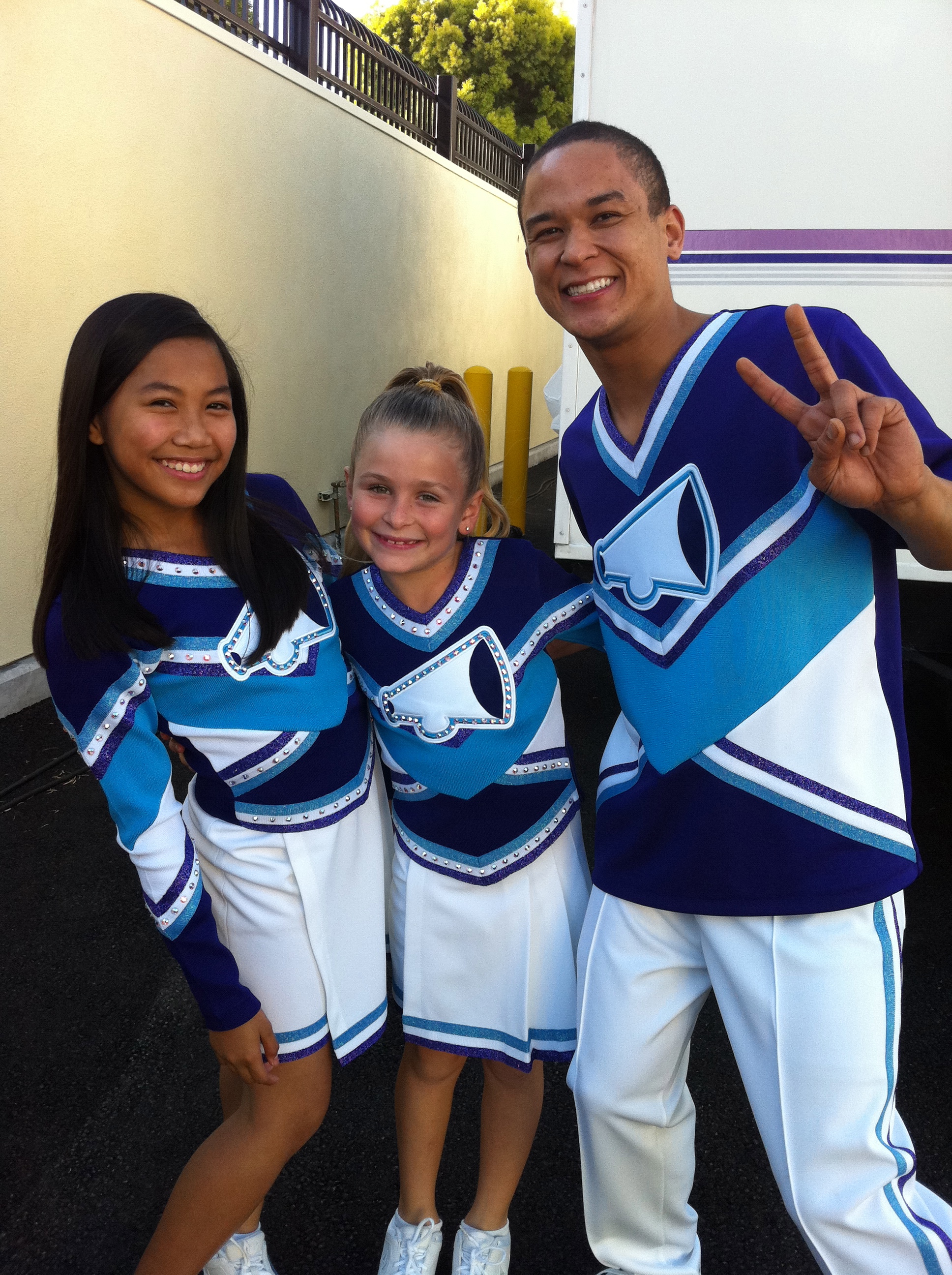 on the set of Fresh Beat Band (Nickelodeon) in cheer uniforms!