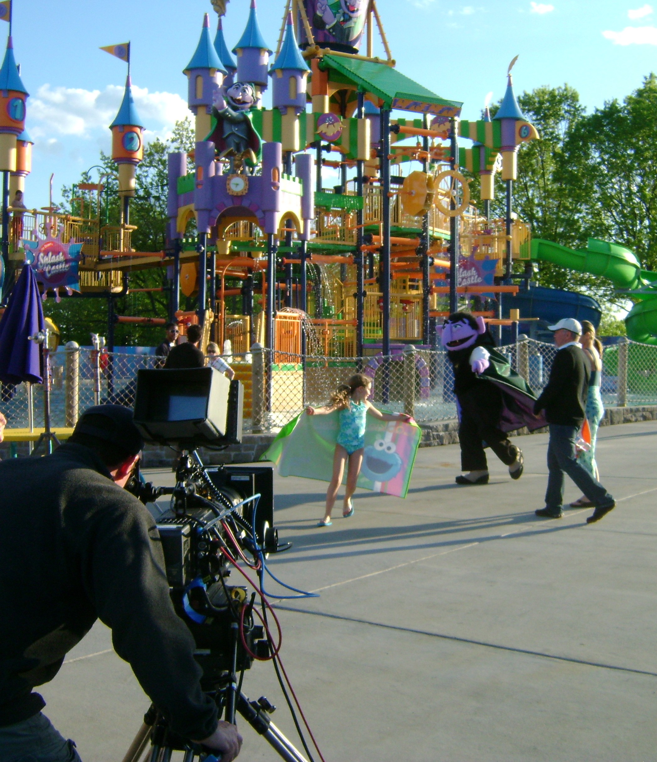 Jodie Shultz, cast and crew on the set of the water park scene of a Sesame Place commercial.