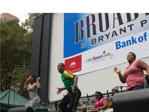 LeeAnet Noble (in gray) performing at Broadway in Bryant Park with the cast of Drumstruck