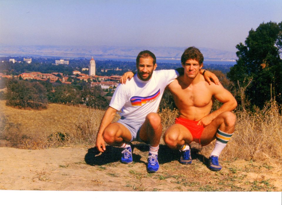L-R Dave and Mark Schultz running in the Stanford foothills one week after the 1984 Olympics where both won gold. Stanford's Hoover Tower and the San Francisco Bay in the background.