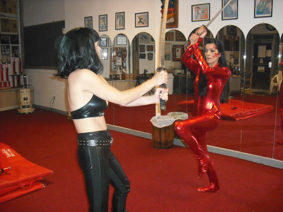 Kristina Michelle and Annette Lawless rehearse a sword fight for Lady Dragon.
