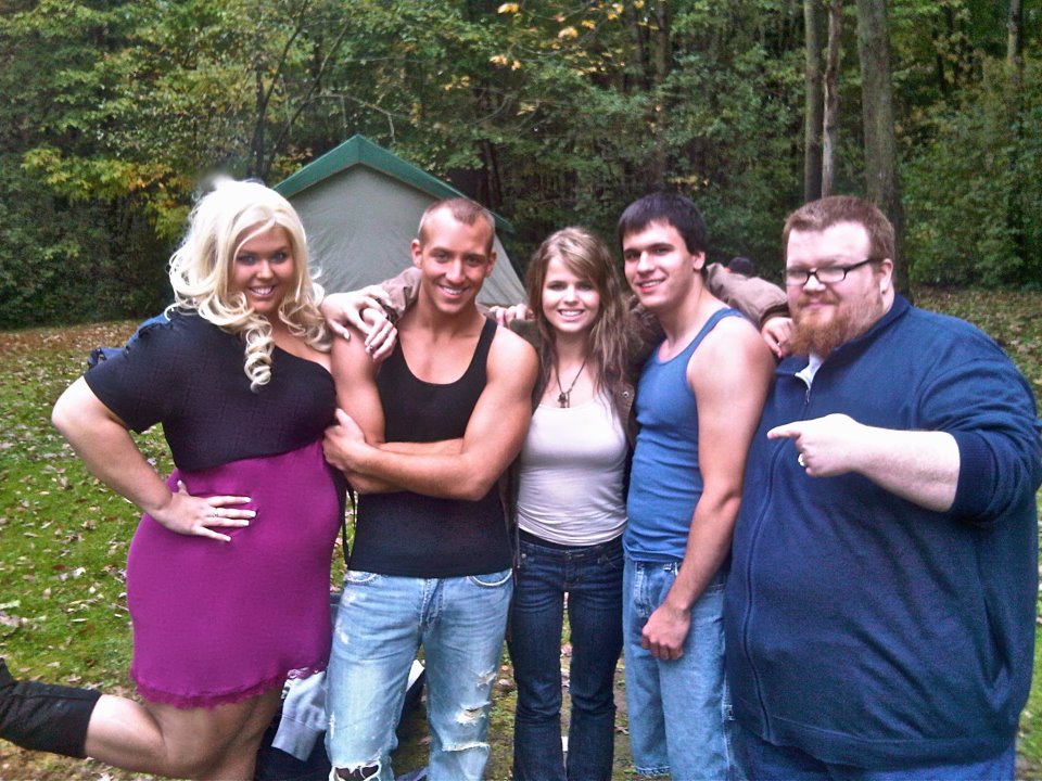 Kristina Michelle, star of Night of the Cannibals, and supporting actors on set.