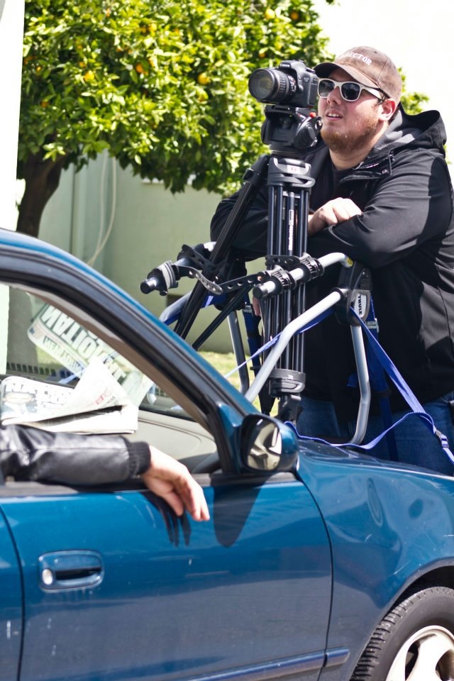 On the set of Necessary Measures, checking the footage from a take on the car mount.