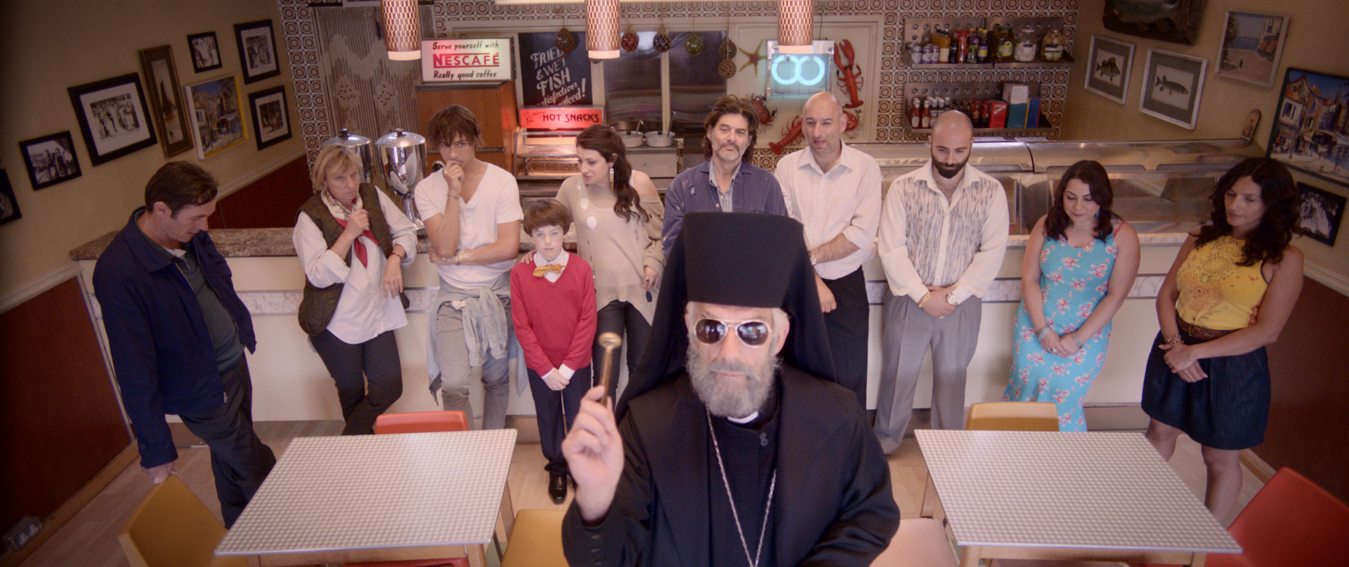 Father Jimmy blesses the refurbished Three Brothers Fish & Chip Shop