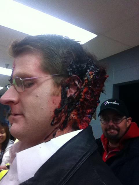 Behind the scenes on the set of A Wish for the Dead after heavy makeup and a prosthesis were added.