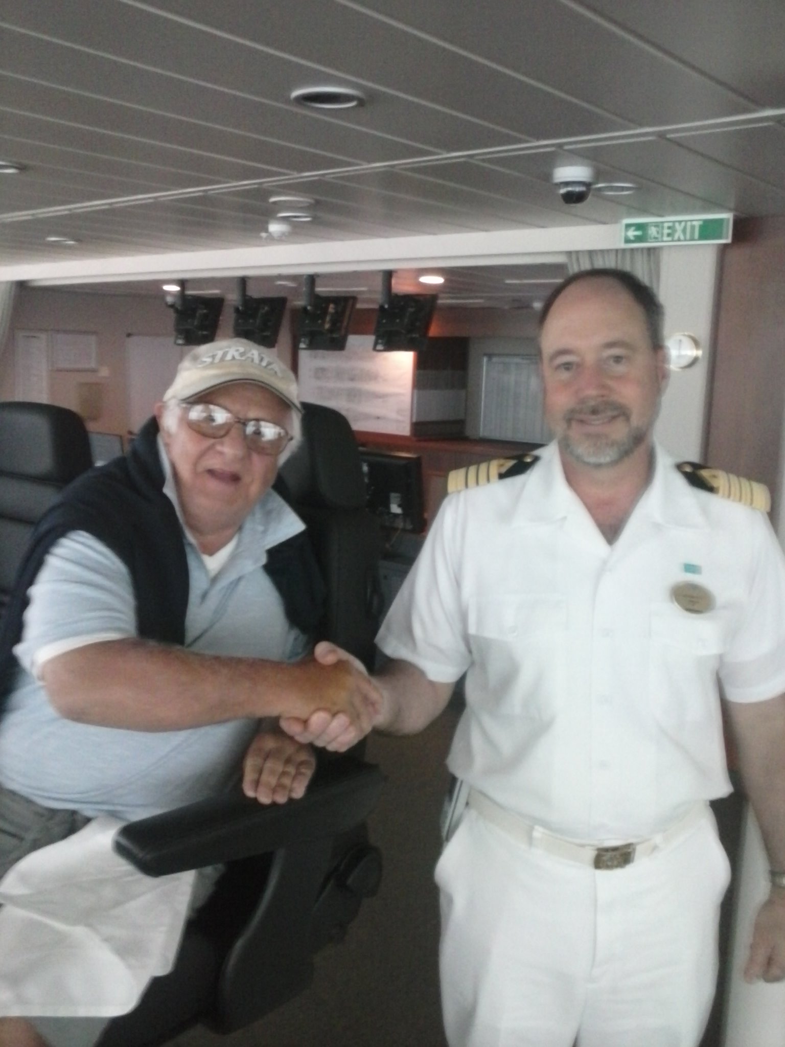 SITTING IN CAPTAIN'S CHAIR IN CONTROL WITH EL CAPITAN - ON SHIPS BRIDGE DECK OF THE BREAKAWAY 'S 6000 PASSENGERS AND CREW. SHIP
