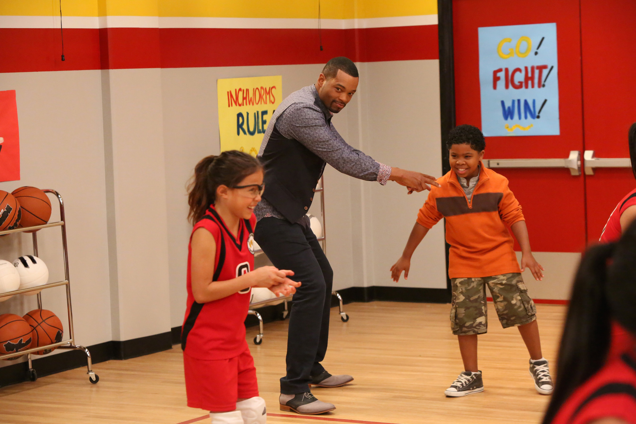 Still of Chico Benymon, Breanna Yde and Benjamin Flores Jr. in Haunted Hathaways (2013)