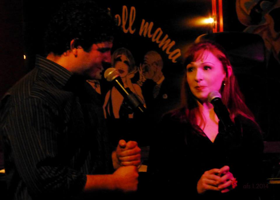 Christina Morrell and Jason Peter Kennedy singing a duet in a performance at Don't Tell Mama's.