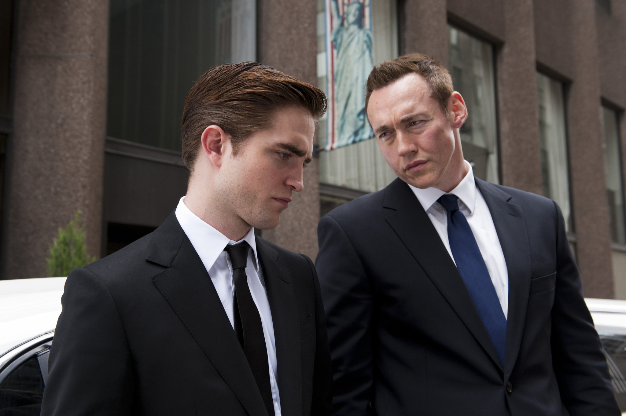 Still of Kevin Durand and Robert Pattinson in Kosmopolis (2012)