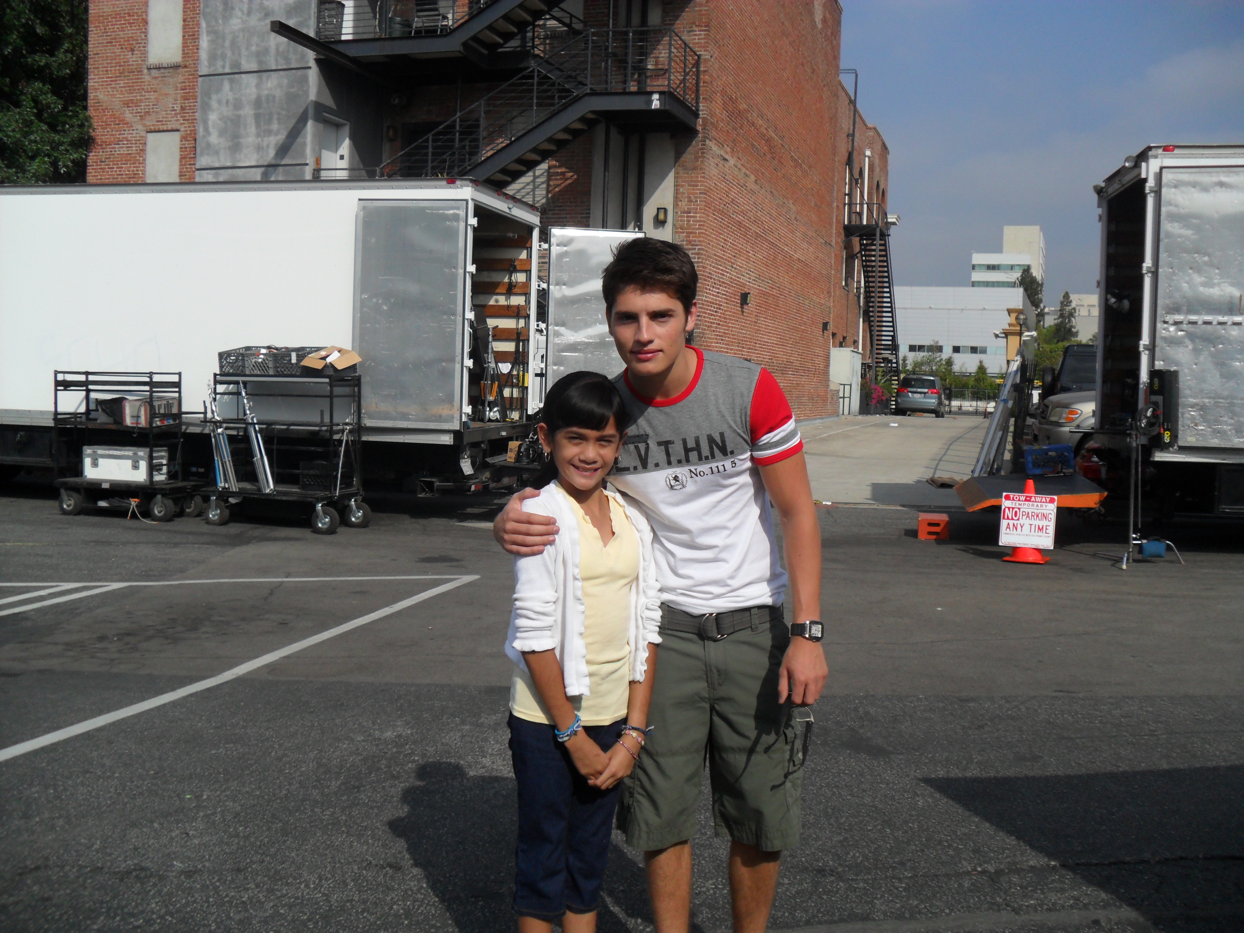 Emily with Gregg Sulkin at the 'White Frog' set.