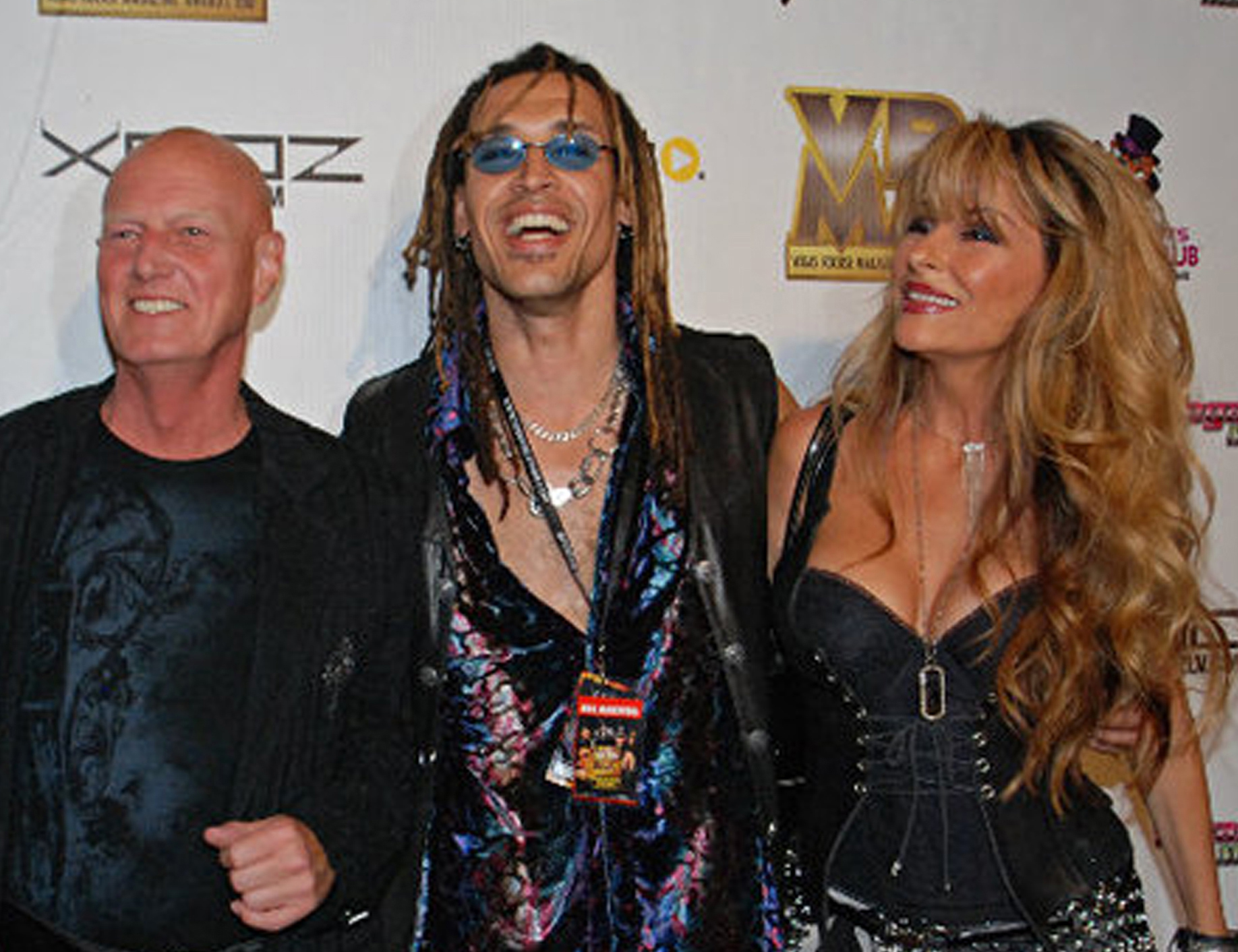 Drumming Legend Chris Slade from AC/DC, Jason Ebs, & Janea Ebs from rock band ECOTONIC on the red carpet @ VegasRocks Magazine Awards Las Vegas Hilton