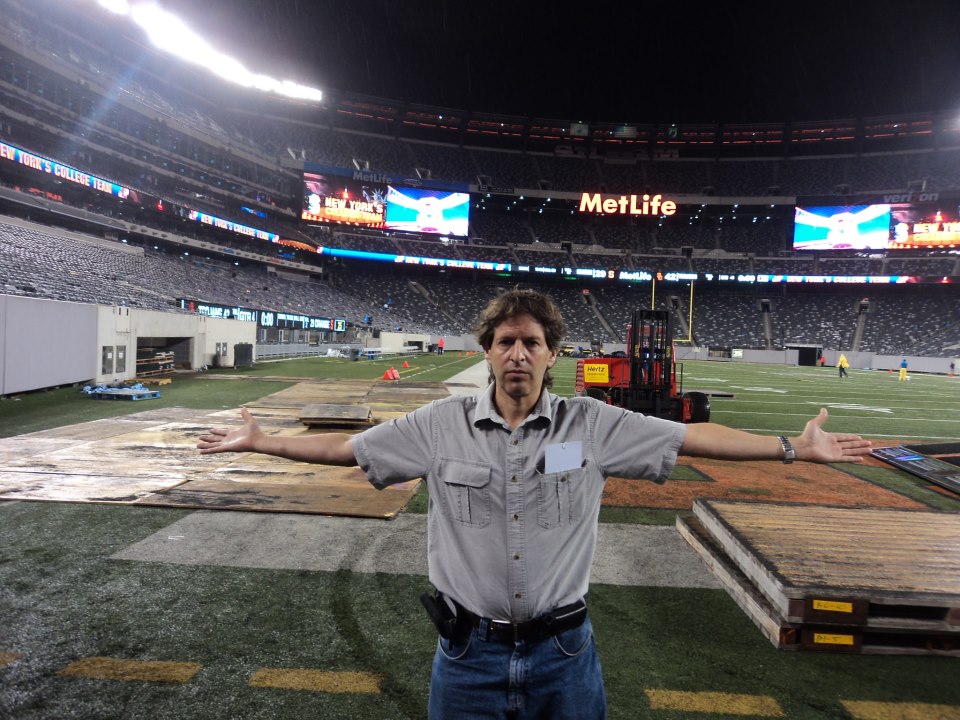 Covering the Syracuse v. USC football game at Giants stadium Sept 2012 After the game, the ground crew went about taking away the field turf