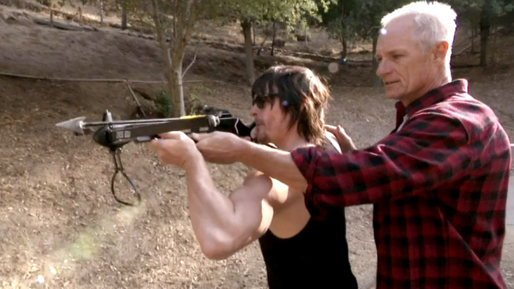 Matt Riedy teaches Norman Reedus how to use a crossbow on Conan