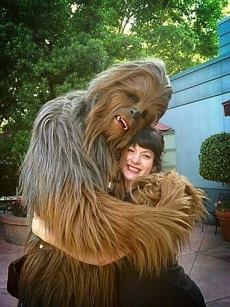 Bonnie Burton gets a Wookiee hug from Chewbacca.