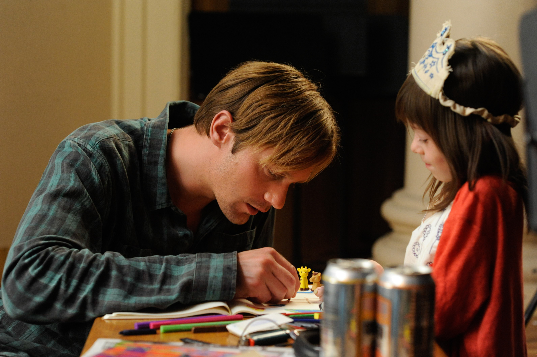 Still of Alexander Skarsgård and Onata Aprile in What Maisie Knew (2012)