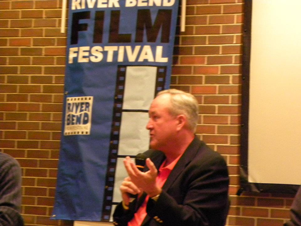 Responding to audience questions during a filmmaker Q&A session following a film screening at the River Bend Film Festival.