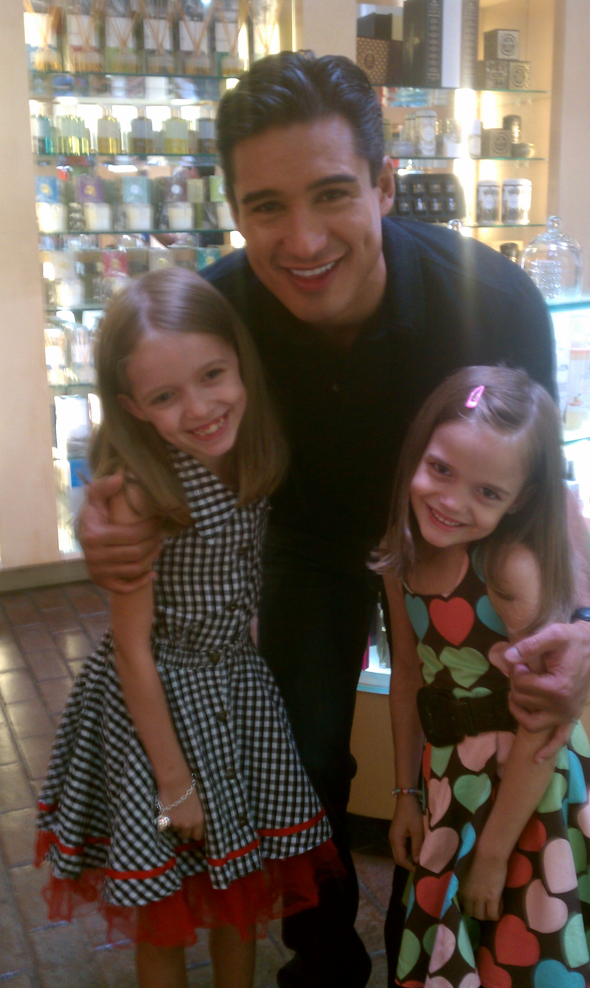 Mykayla and sister Hannah with Mario Lopez at the launch of the Vinci tablet.