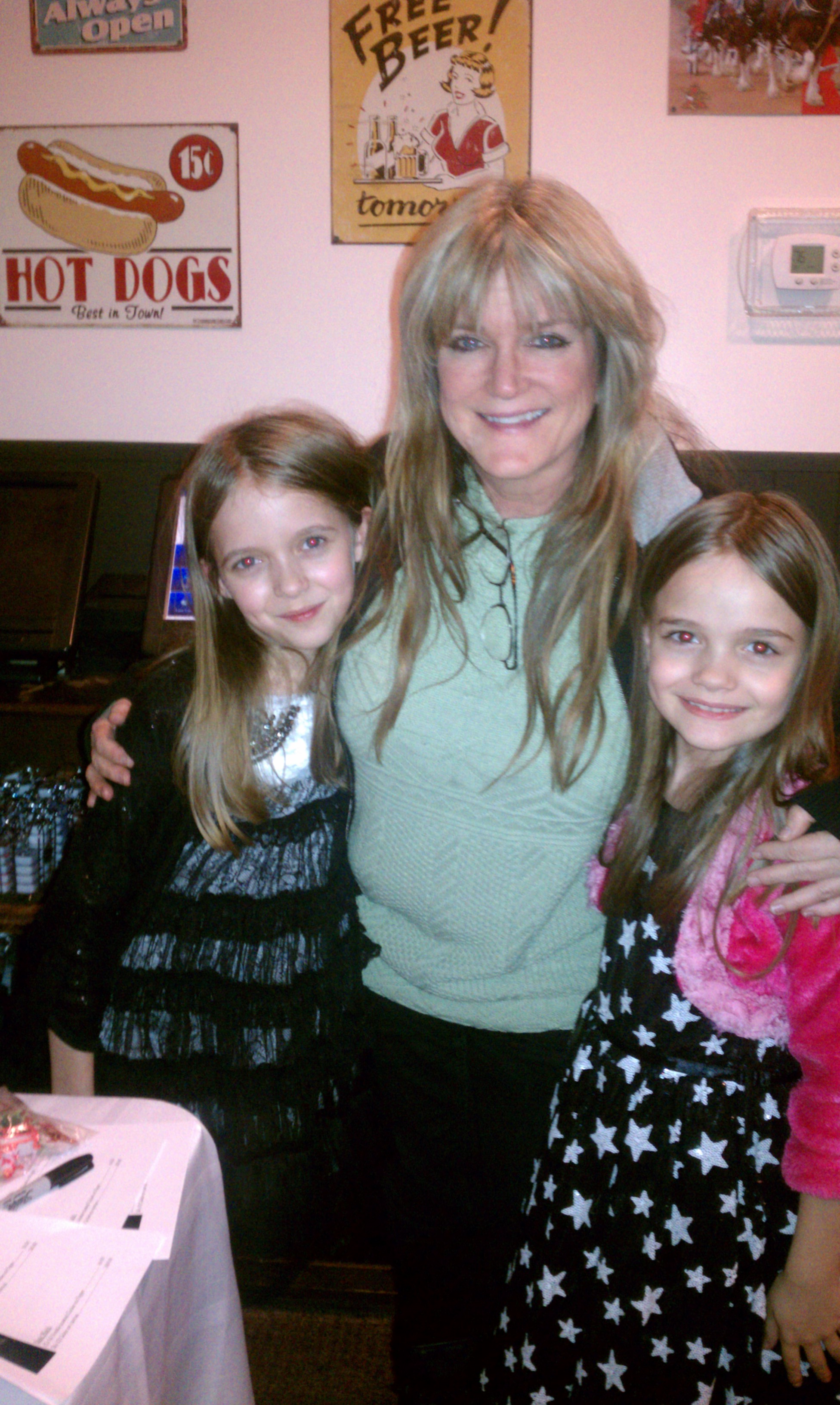 Mykayla and sister Hannah with Susan Olsen at a fundraiser for Precious Paws.