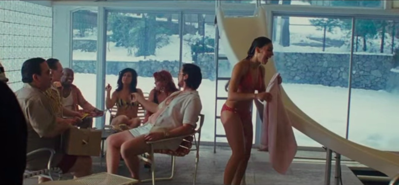 Screenshot of Alexis Capozzi alongside Christian Bale in American Hustle.