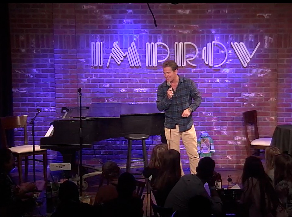 Johnno Wilson performing at The Hollywood Improv