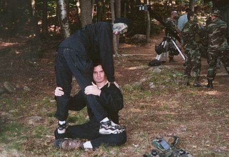 Stretching with the help of a friend at a special operations training weekend.