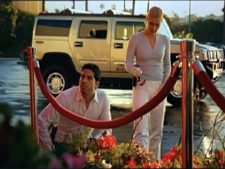 Still of Emily Procter and Adam Rodriguez in CSI Majamis (2002)