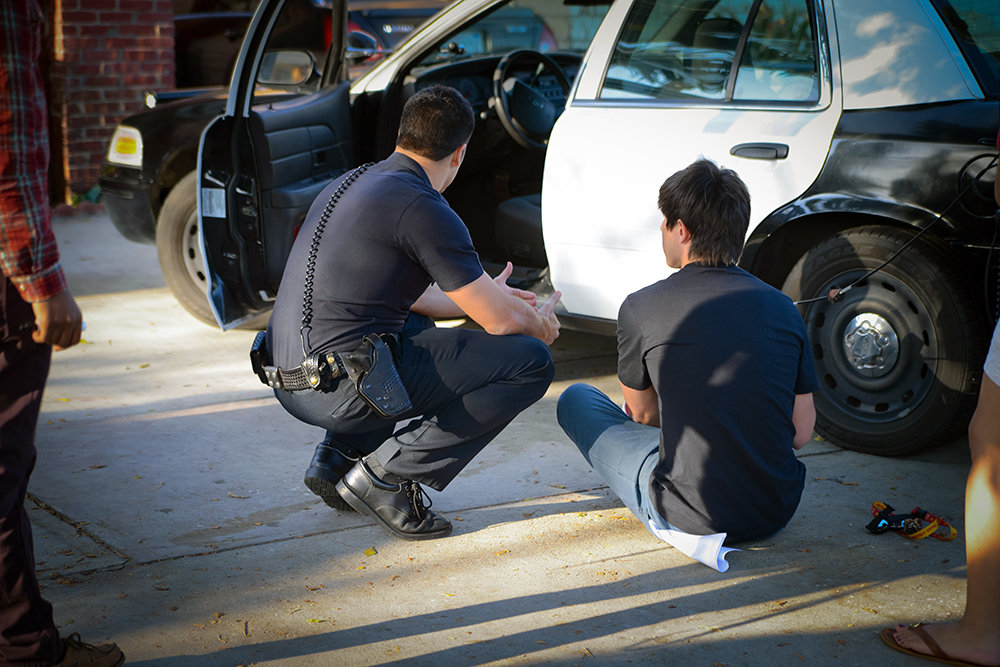 Writer-Director Addison Sandoval walks Actor Jordan Nistico through a scene on location in South Central, Los Angeles.