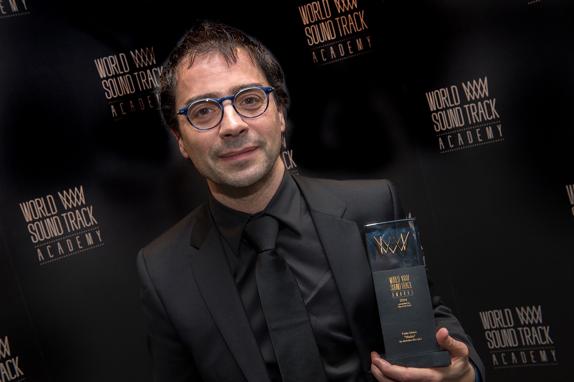 Michelino holding World Soundtrack Award 2014