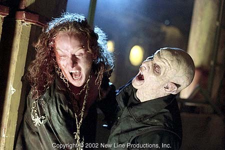 Priest (Tony Curran, left) attempts to fight off a Reaper in New Line Cinema's action thriller, BLADE II.