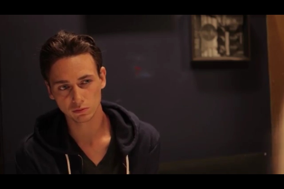 Screen capture of actor Alexander Rain in the role of Pat, originally portrayed by actor Bradley Cooper, in recreation of the diner scene from 