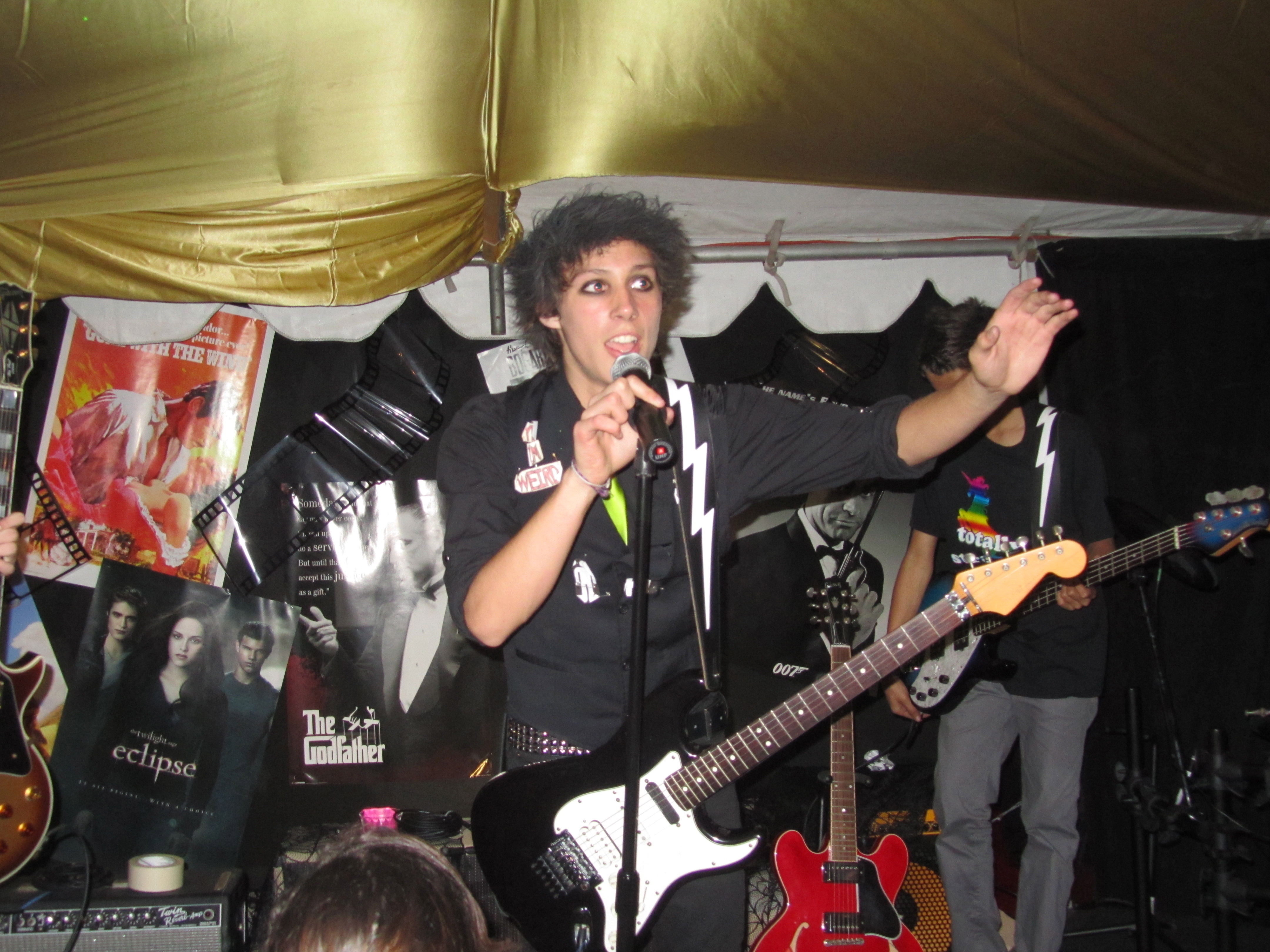 Cameron singing with his band 