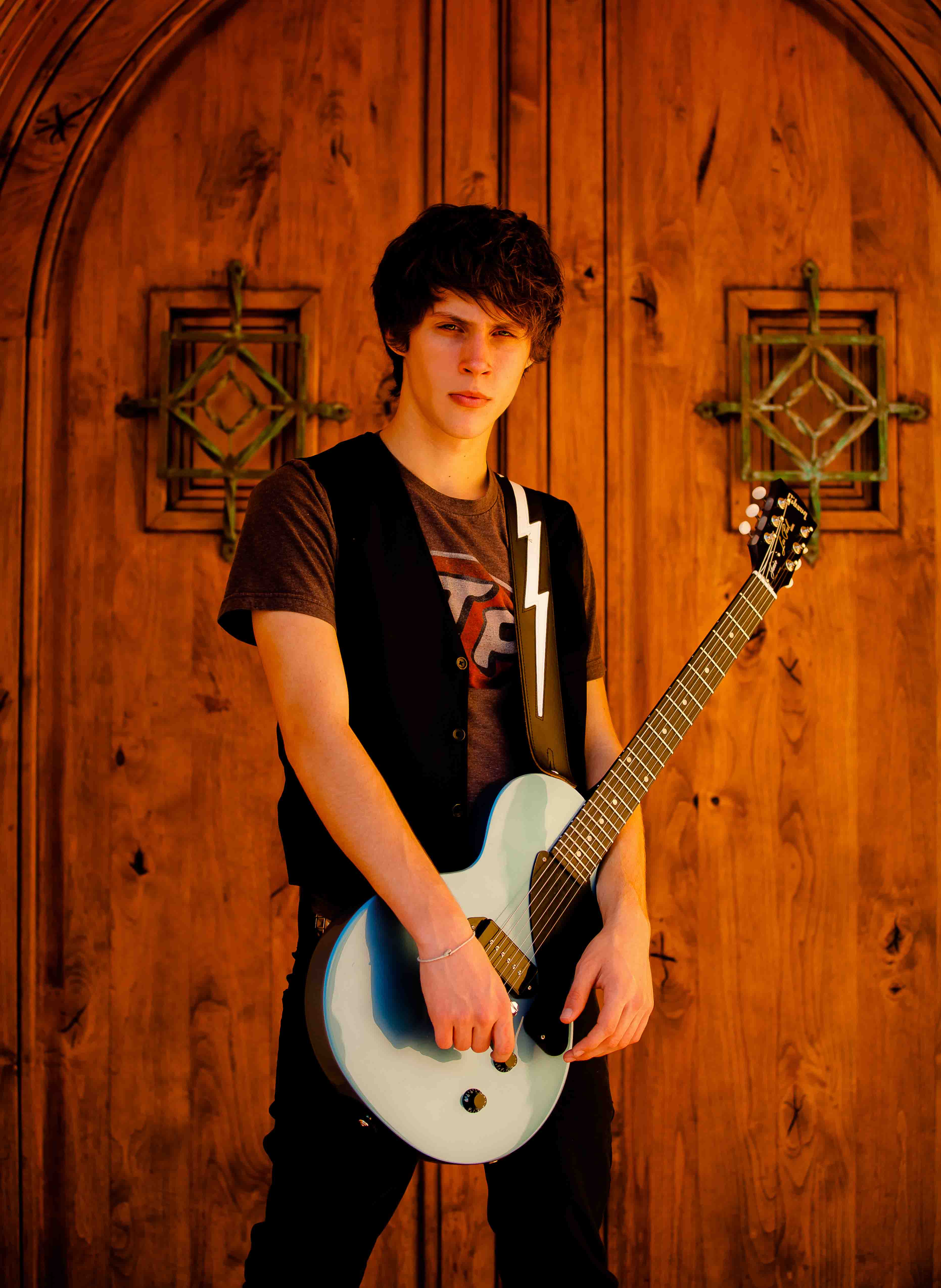Cameron also write and records songs. Posed here with his newest guitar, a 