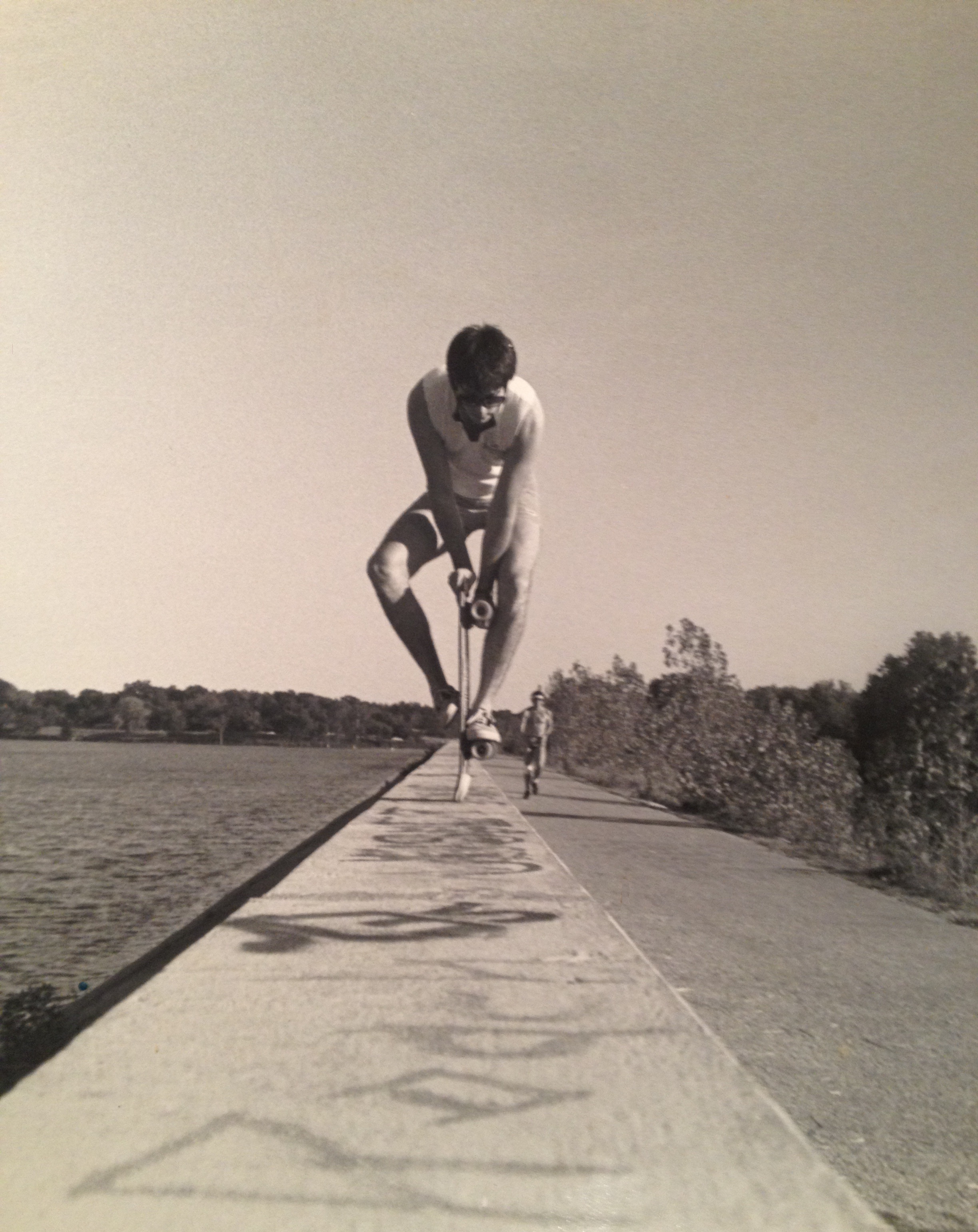 Vintage Greg doing a skateboard tail stand on top of the dam at White Rock Lake Dallas, circa 1986.