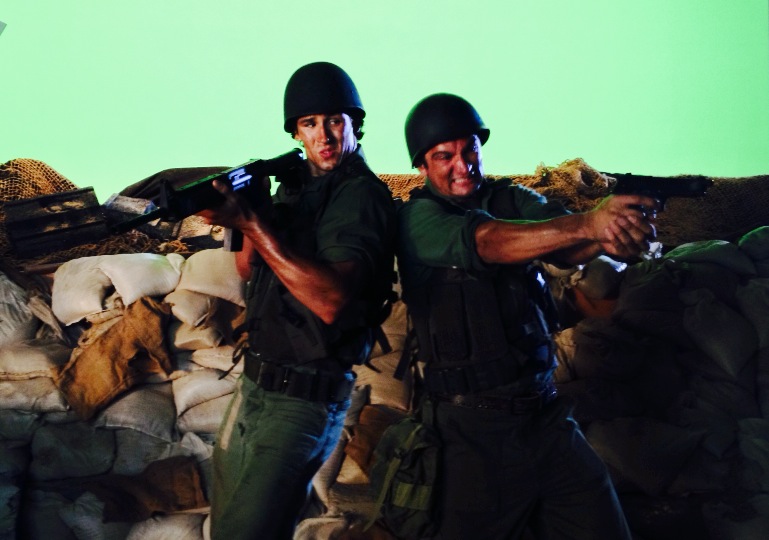 Paul Black and brother Josiah Black performing in front of green screen.