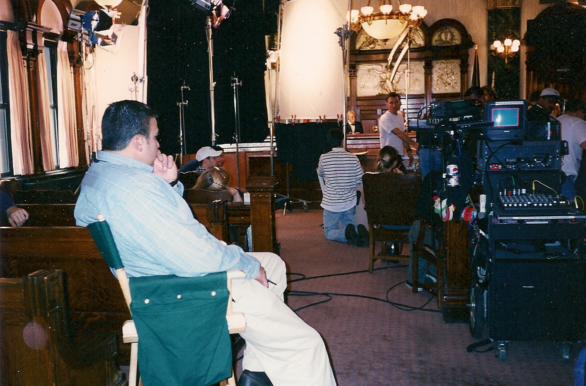 Currá looks onto the set while on location with, United Studios Stories from the Mines. The location is Courtroom III in the Lackawanna County Courthouse, where the first Presidential Commission met to arbitrate the 1902 Anthracite Strike.