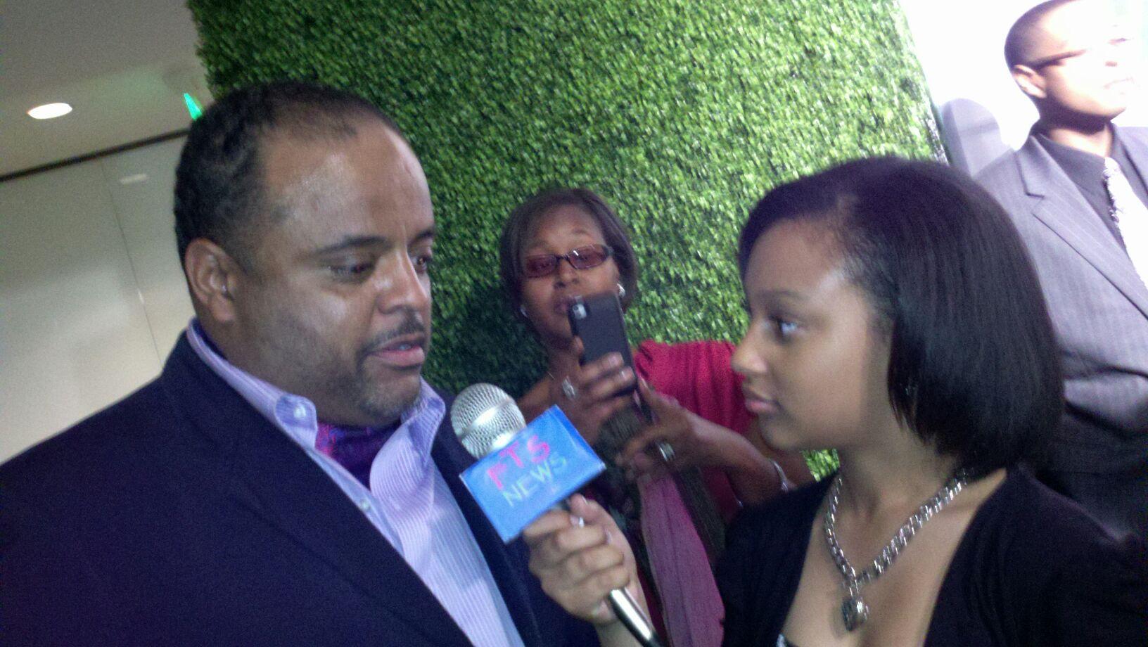 Aliyah at event with Roland Martin