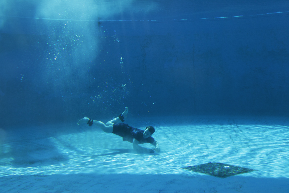 Underwater escape from five pairs of regulation handcuffs as fastened on by officers of the New York Police Department for an escape at the New York Aquarium.