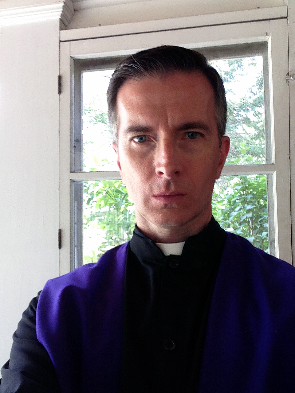 Candid still of Tom McLaren as Father James in 