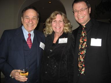 Songwriter Richard Sherman with Tracey and Vance Marino at the SCL Holiday Party