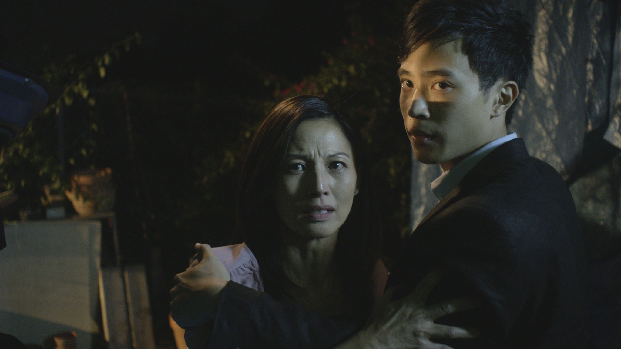 Still of Tamlyn Tomita and Hayden Szeto in The Unbidden (2016)