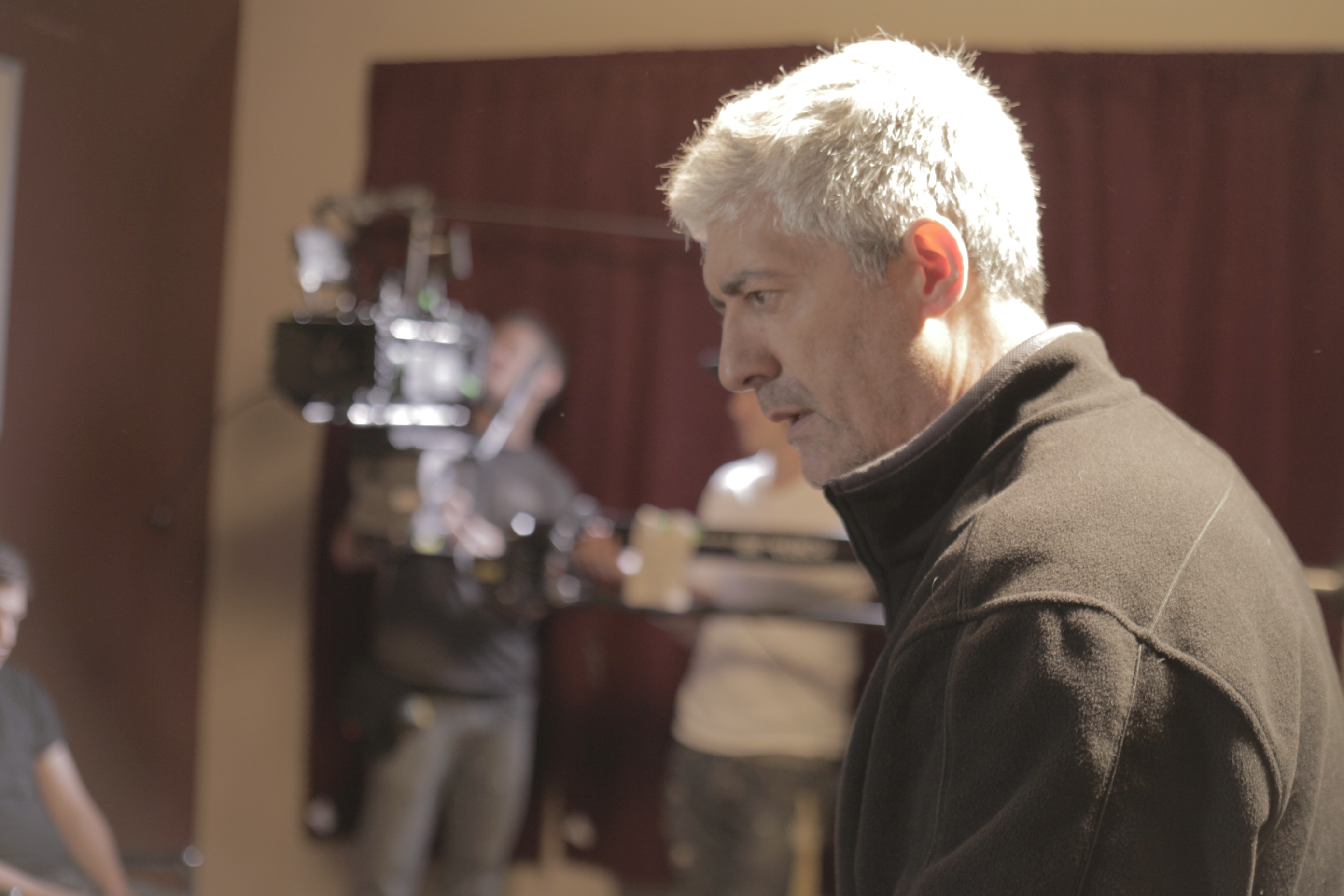 Actor Alain Azoulay rehearses his role as Bruce B. Gordon directs his performance in 