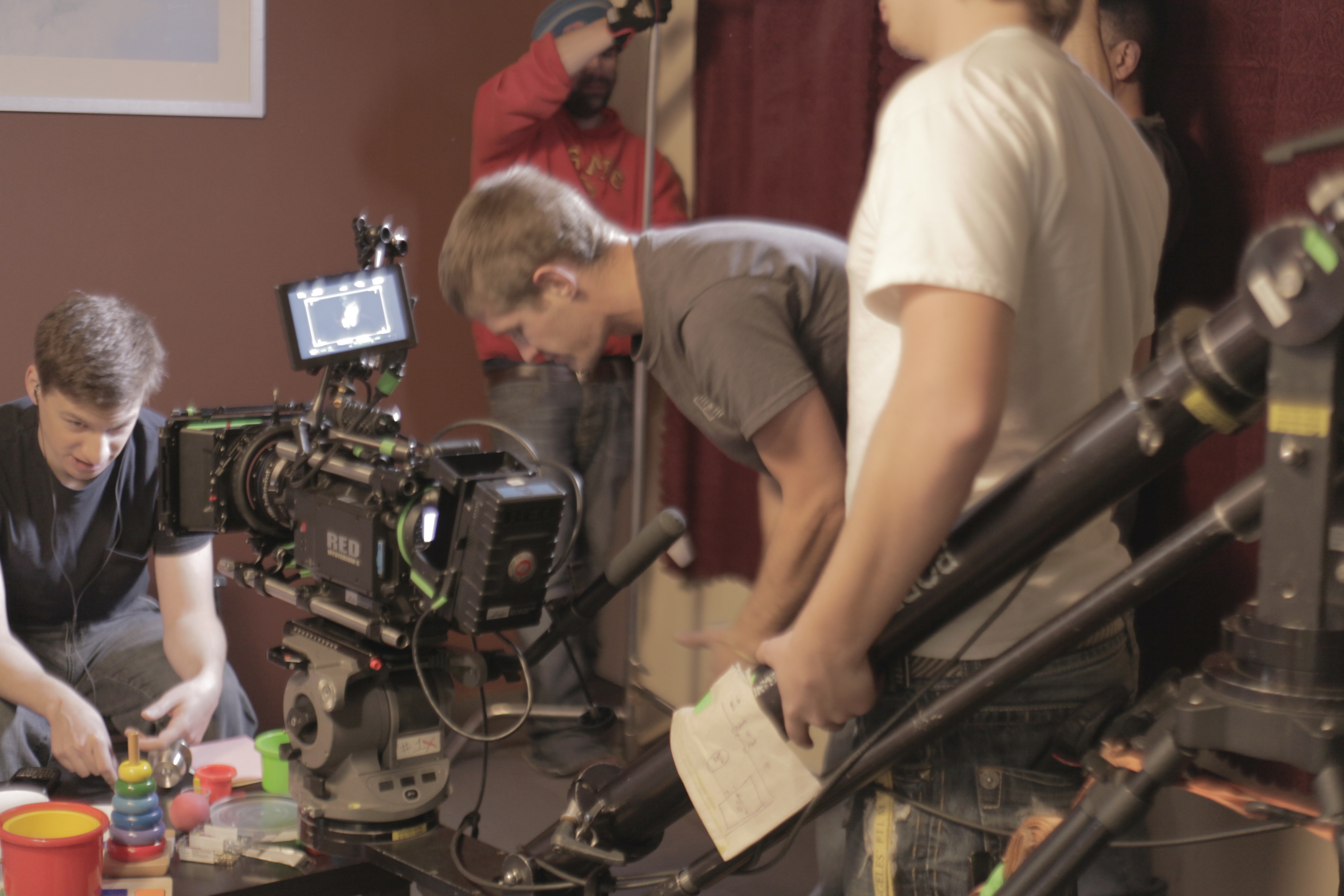 Camera assistant David Condrey working out director Bruce B. Gordon's camera blocking as actor Brett Emanuel works on his character of Randy Larson in 