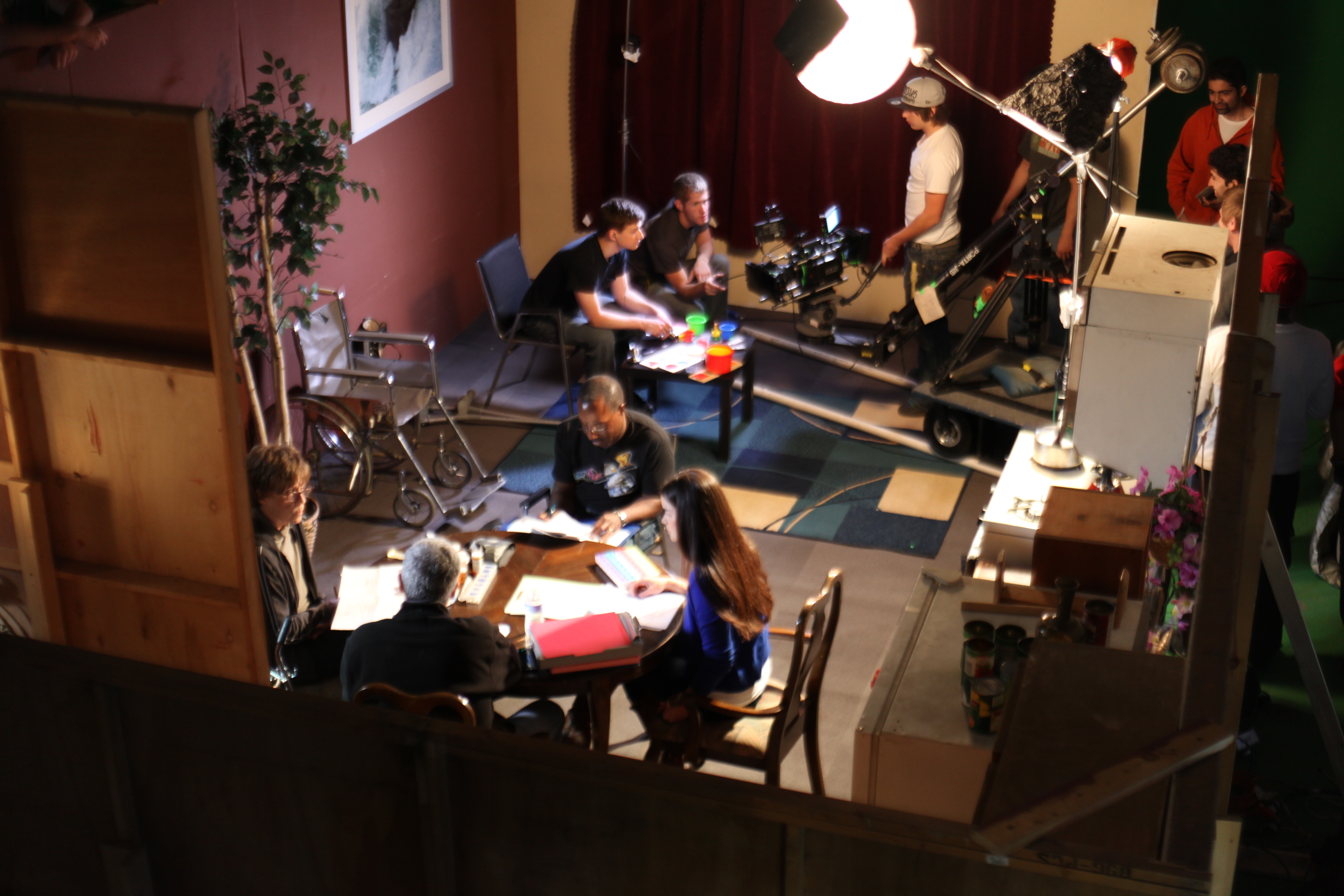 Director Bruce B. Gordon changing actors' dialogue on the set of 
