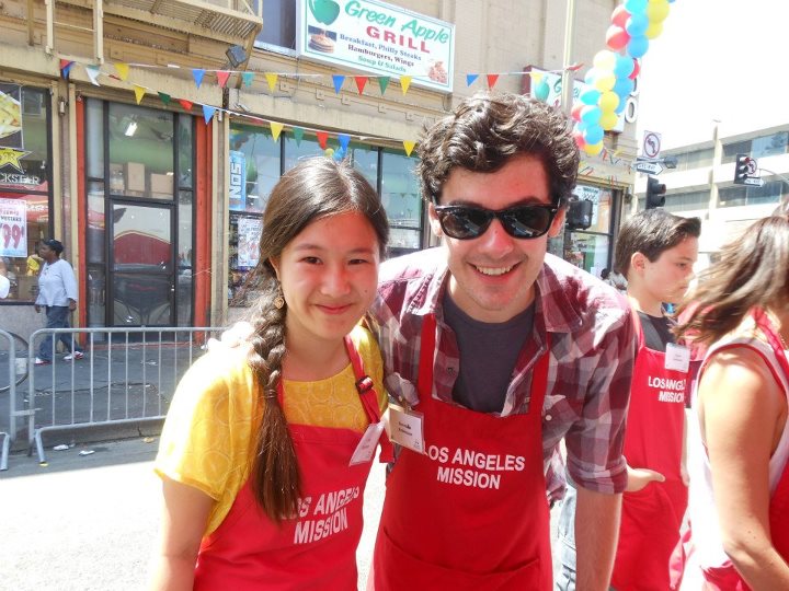Actress Tina Q. Nguyen and actor Brendan Robinson (Pretty Little Liars) volunteers at the Los Angeles Mission's End of Summer Block Party on August 25, 2012