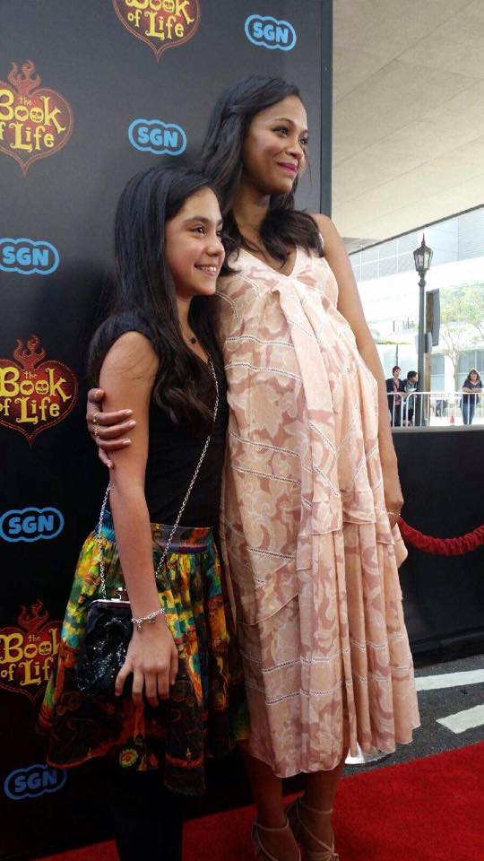 Genesis Ochoa with actress Zoe Saldana at the Los Angeles premiere for The Book of Life