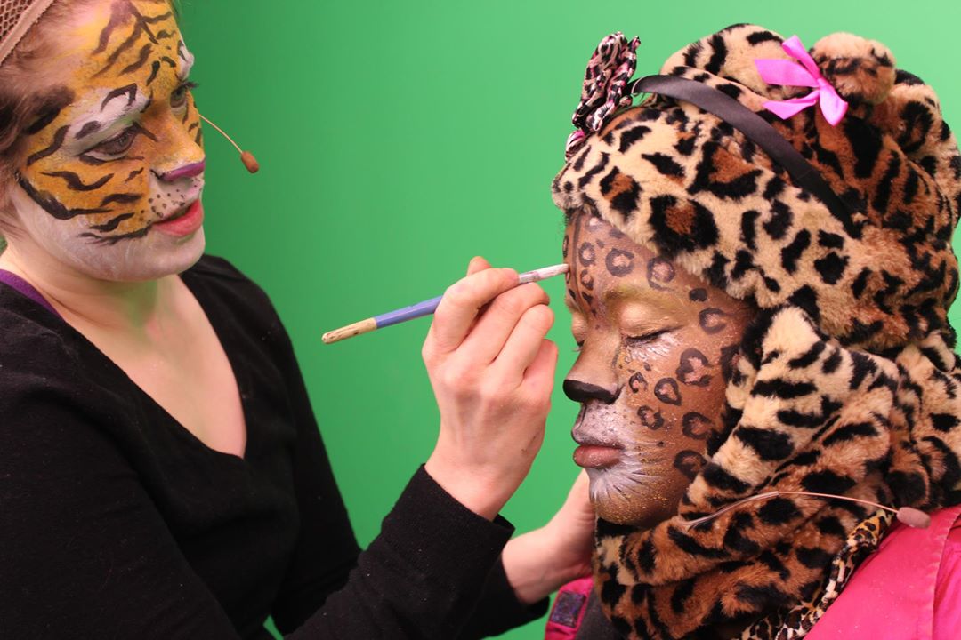 Jessica applies makeup to fellow cast member on Green Screen Adventures