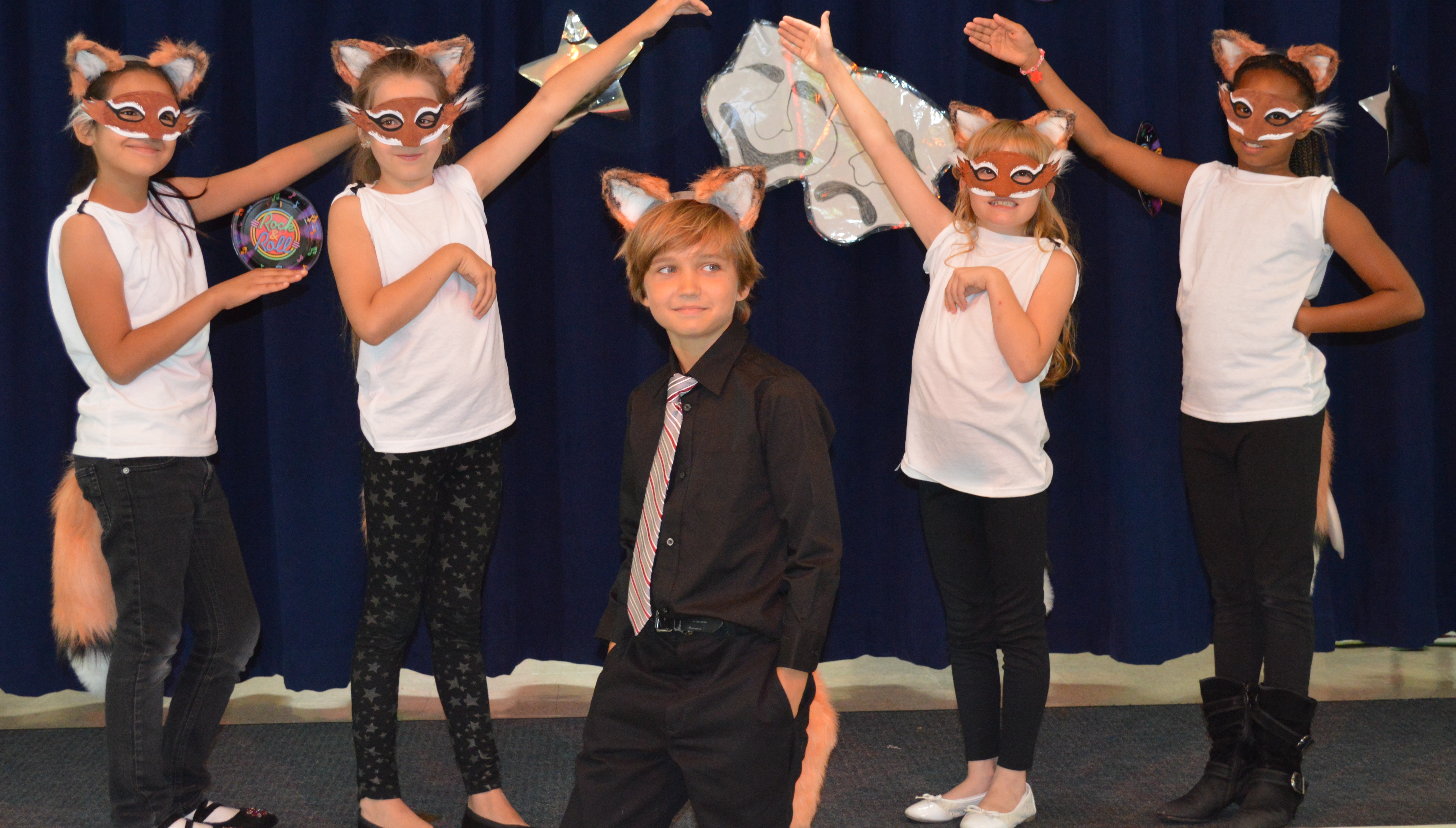 Ryan Veronick with back up dancers.Doing his first comedy act and singing What Does The Fox Say at his 3rd grade talent show. June 6 2014